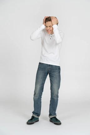 Young man in casual clothes standing