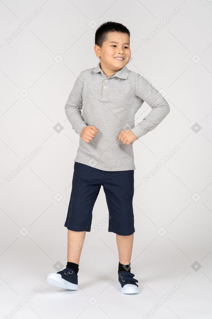 Cheerful boy dancing