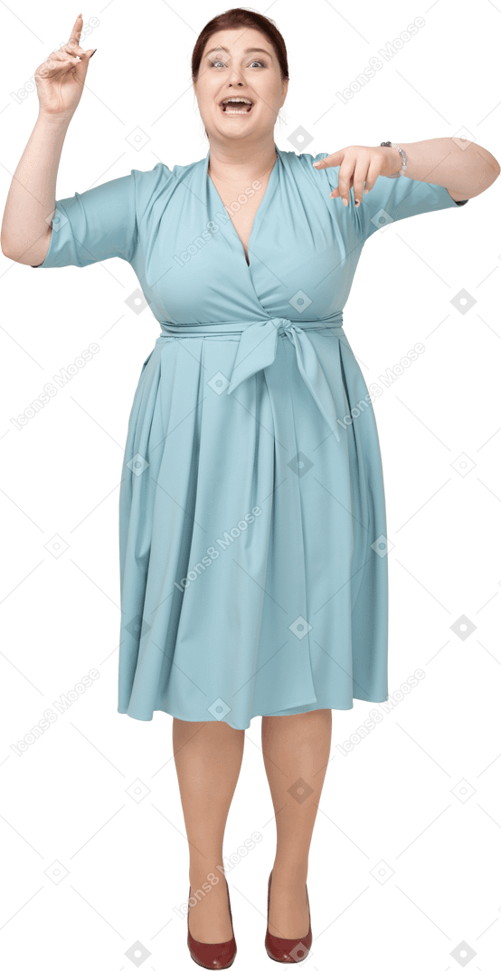 Front view of a woman in blue dress dancing