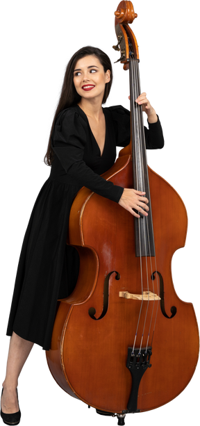 Front view of a smiling young woman in black dress playing her double-bass