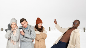 A group of people standing in the snow