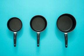 Three frying pans