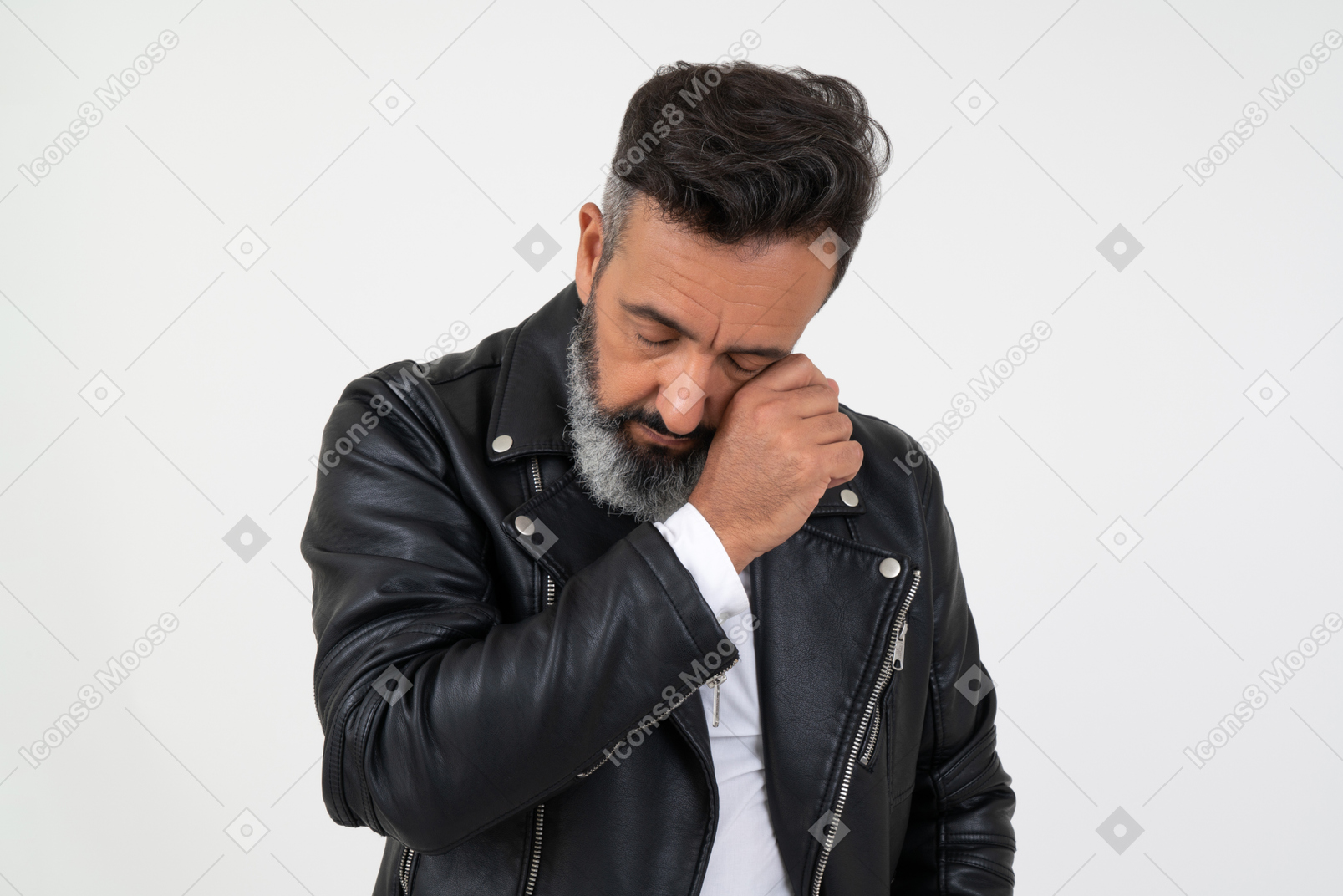 Mature man looking sad and wiping his tears