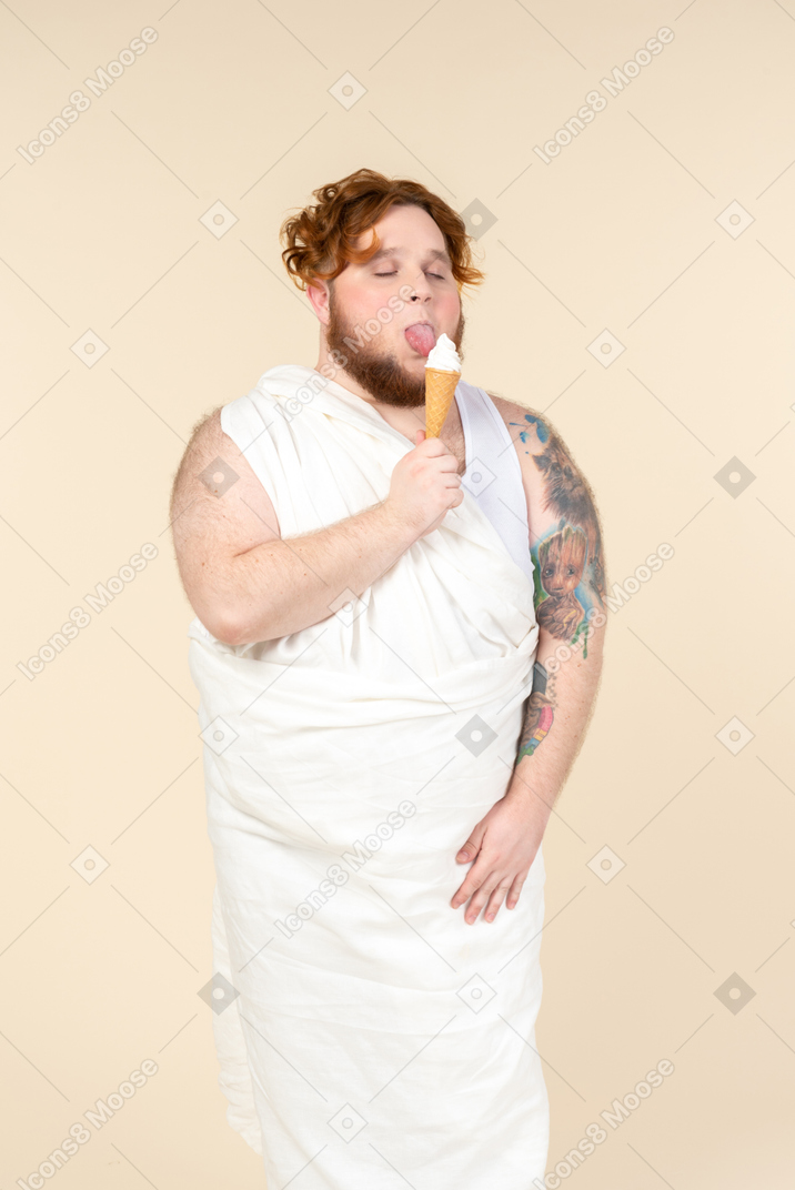 Big man dressed as a cupid eating ice cream