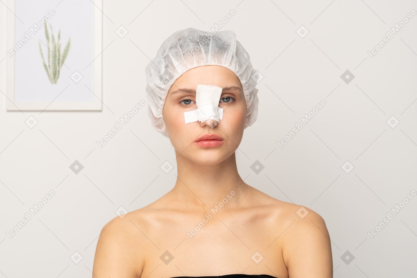 Young female patient with bandaged nose