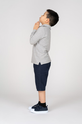 Boy praying in profile