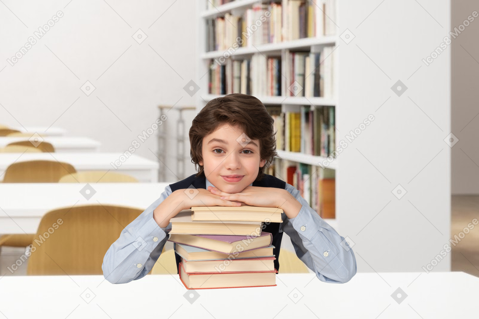 A young boy sitting behind a stack of books
