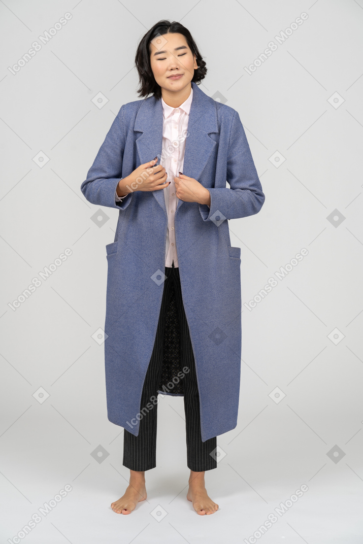 Cheerful woman adjusting her clothes