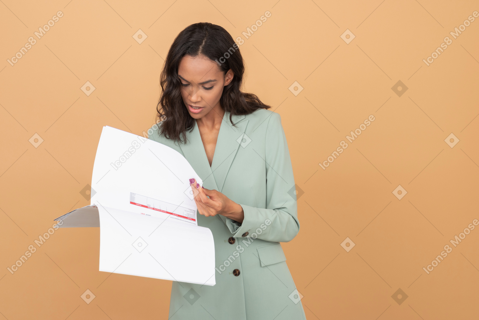 Beautiful office worker folding papers ond checking information
