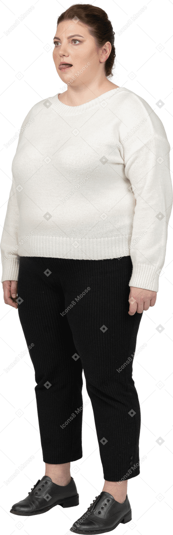 Plump woman in casual clothes showing tongue