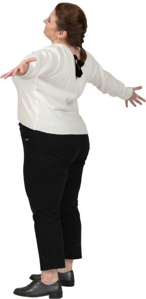 Happy plump woman in casual clothes posing