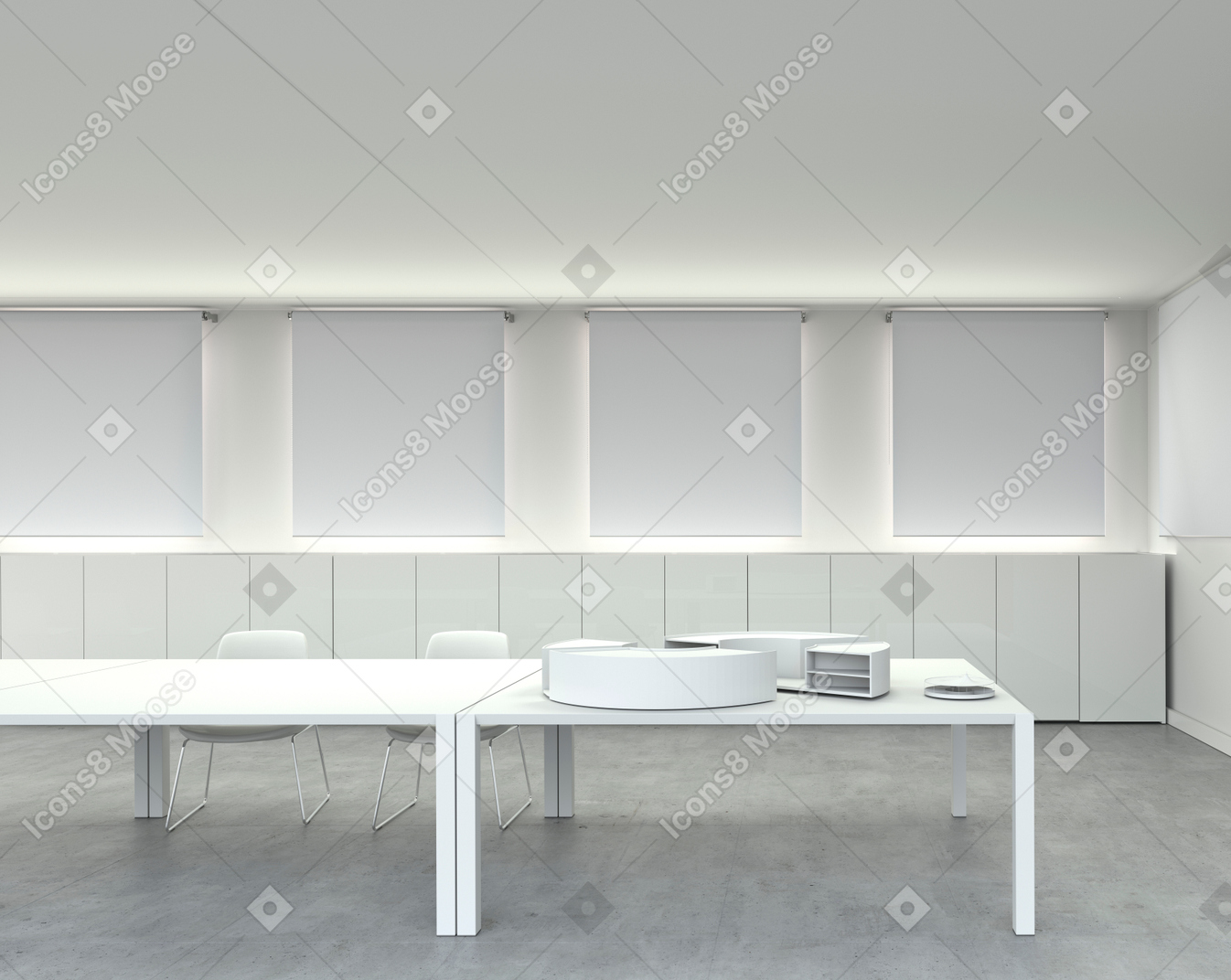 Sala blanca con escritorios y sillas