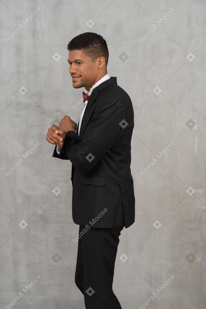 Man in black suit smiling