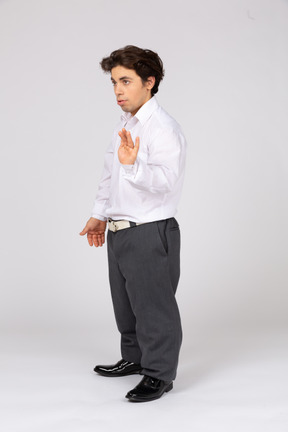 Young man in business casual clothes gesturing