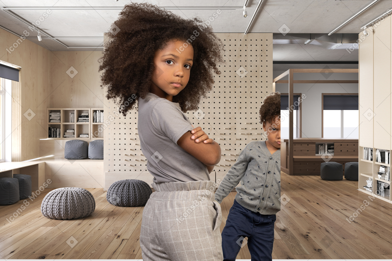Two children standing in a room with wooden floors