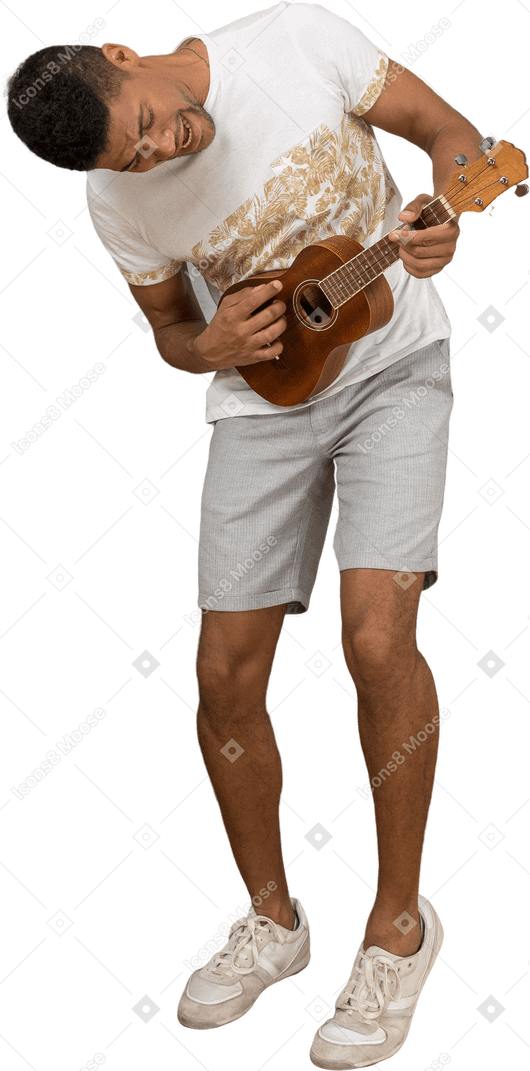 Three-quarter view of a man leaning forward and playing ukulele excitedly