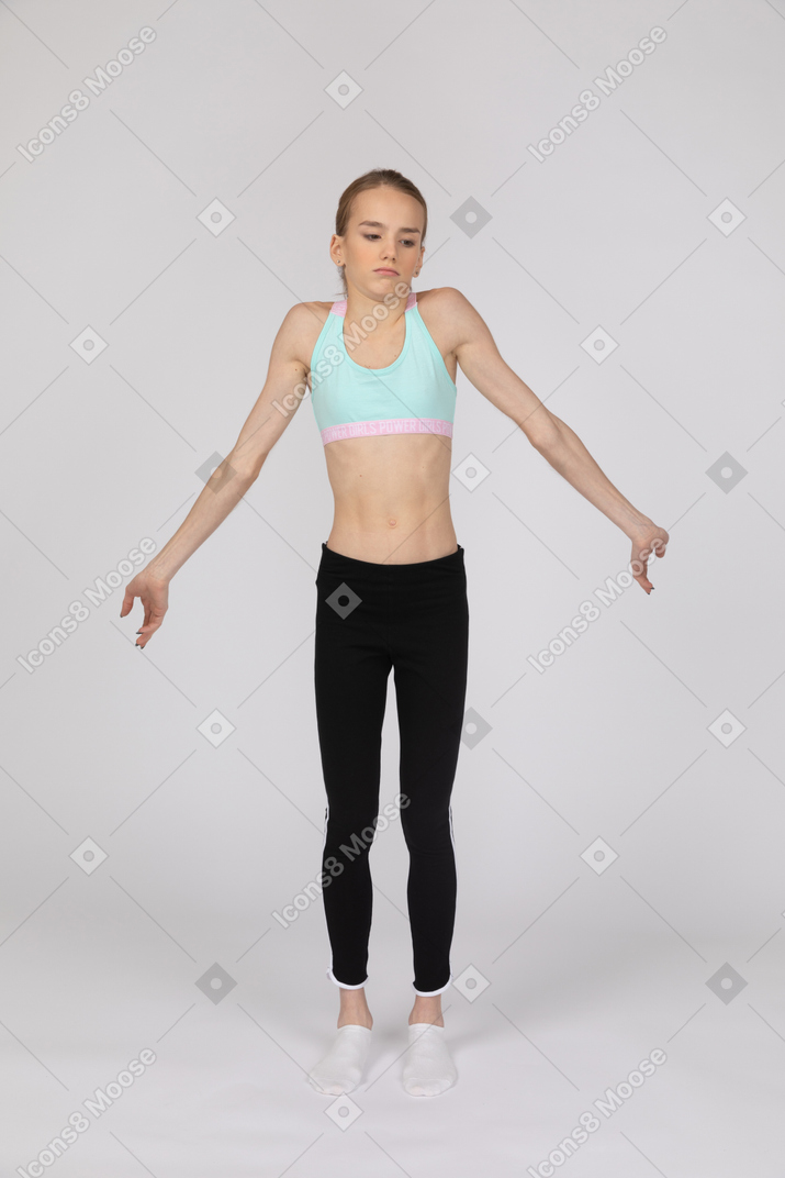 Confused girl standing with her arms spread