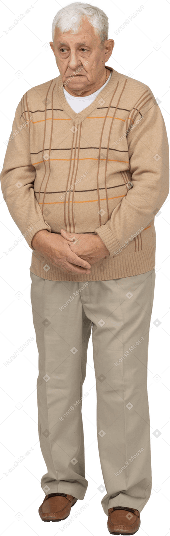 Front view of a sad old man in casual clothes