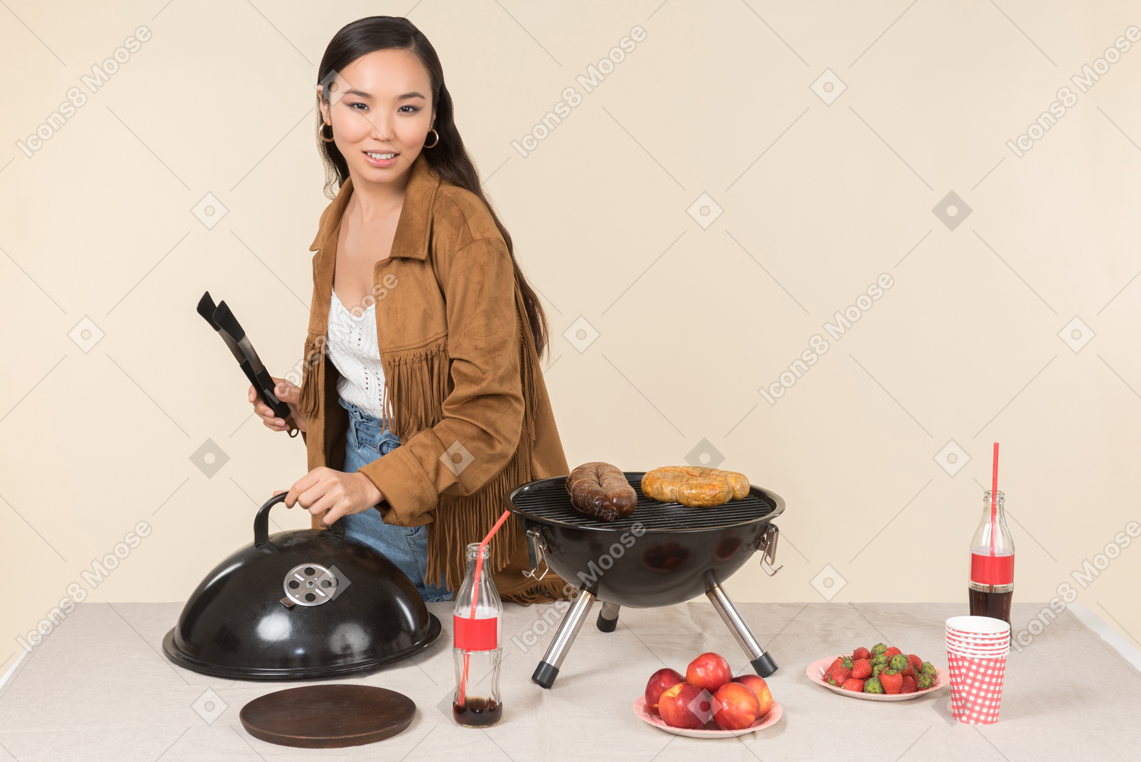 Young asian woman doing a bbq