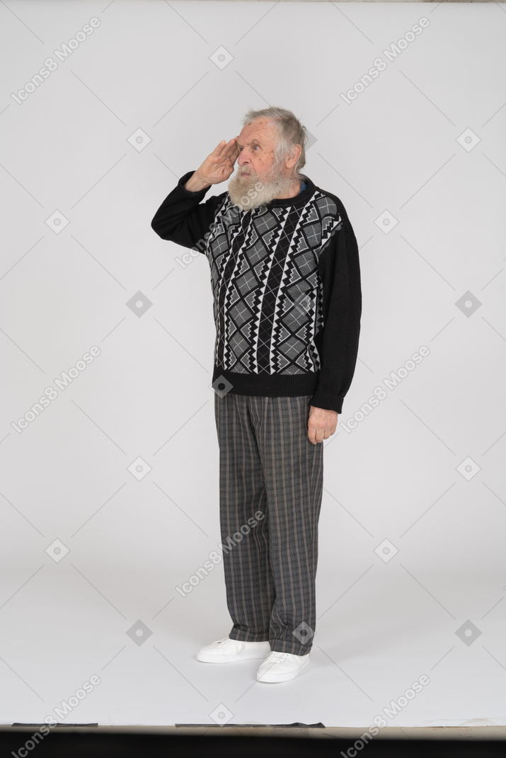 Old man standing and saluting