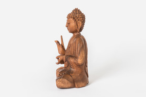 Buddha statue placed in profile on white background