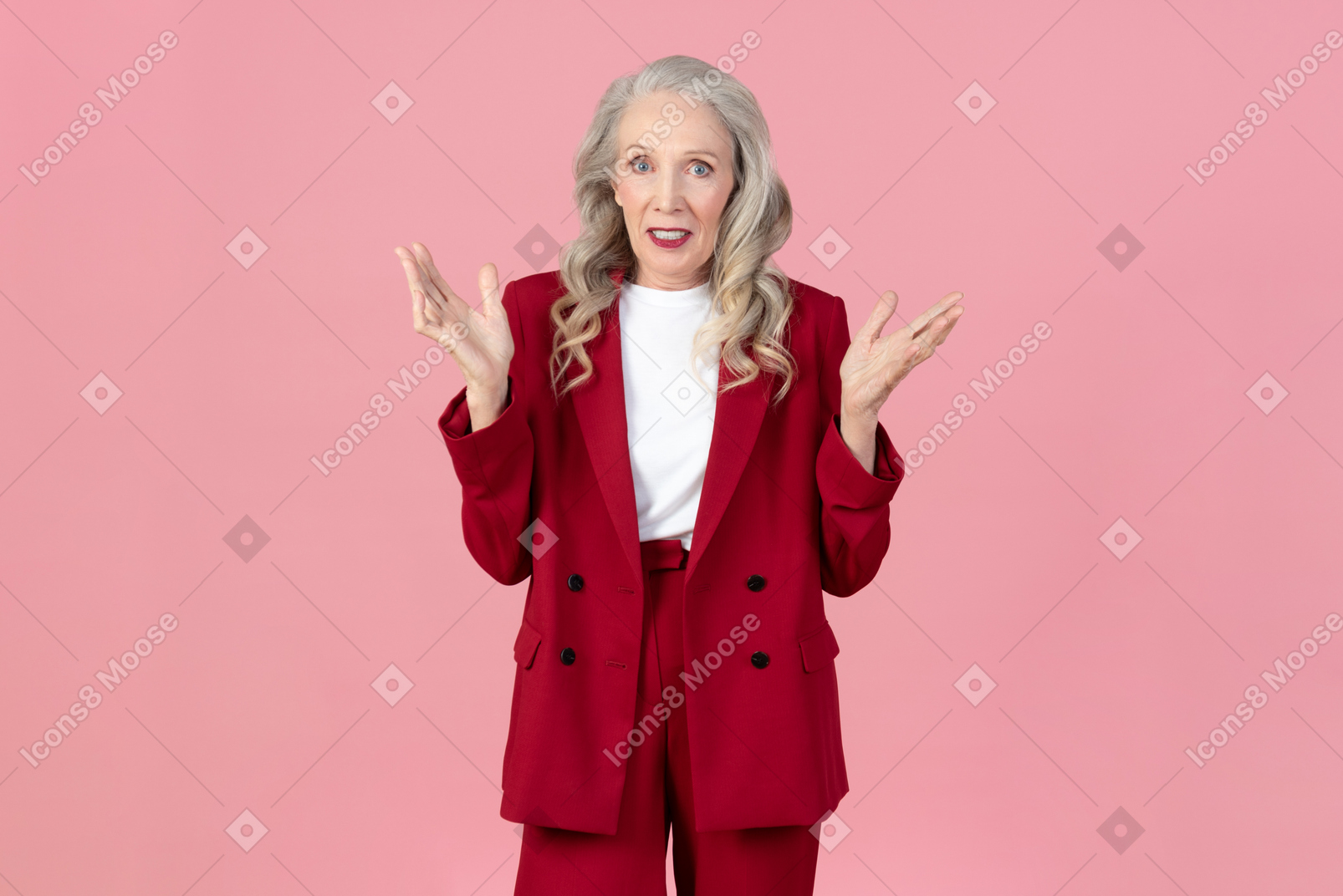 Aged fashonable woman looking lost and holding her hands up