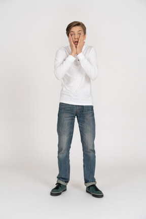 Young man in casual clothes standing