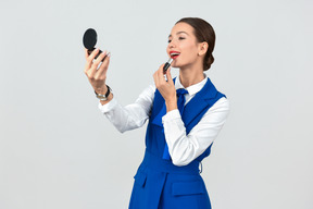 Beautiful flight attendant in a blue uniform