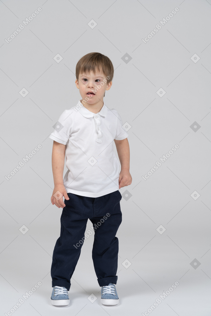 Front view of little boy looking surprised