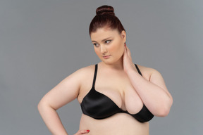 Close-up of a plump caucasian woman in black bra