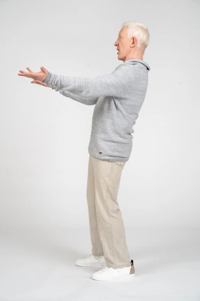 Side view of a man with arms reaching out