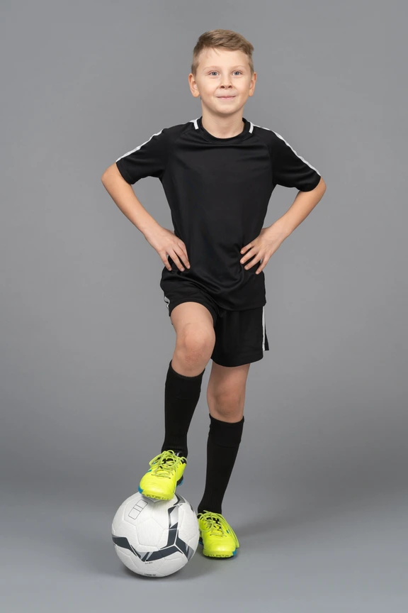 Little Boy Football Uniform Standing One Leg Ball Stock Photos - Free &  Royalty-Free Stock Photos from Dreamstime