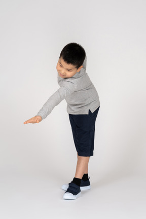 Little boy stretching hand