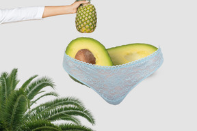 Avocado in underwear with pineapple above