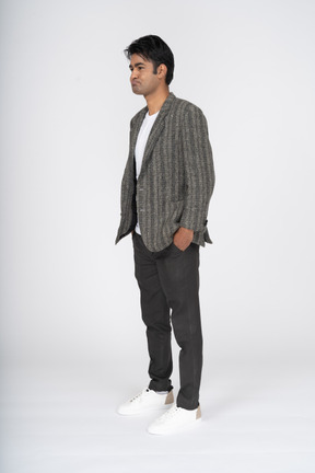 Side view of man wearing jacket and jeans