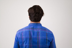 Back view of a young man standing