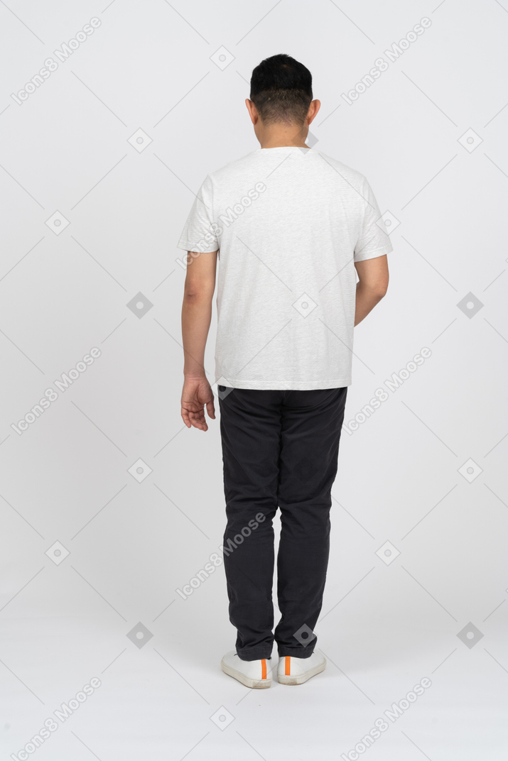 Man in casual clothes standing back to camera