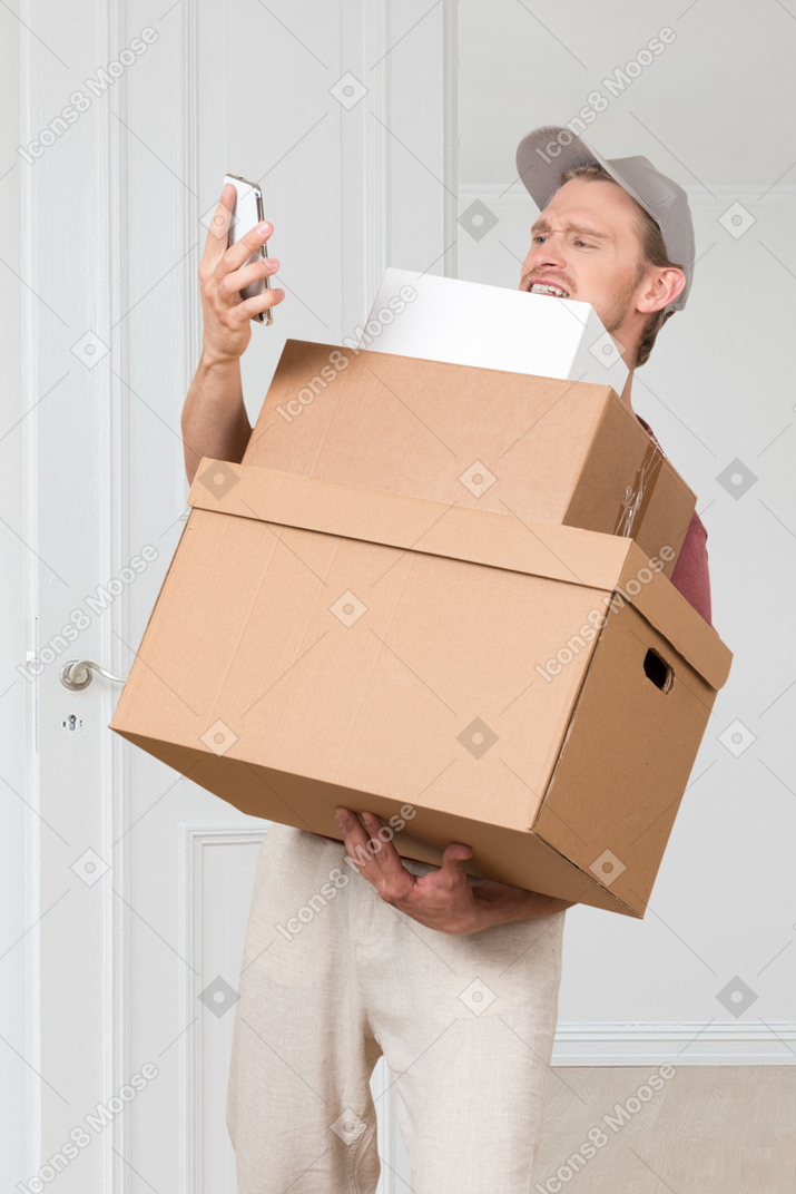 A man in a suit with a box