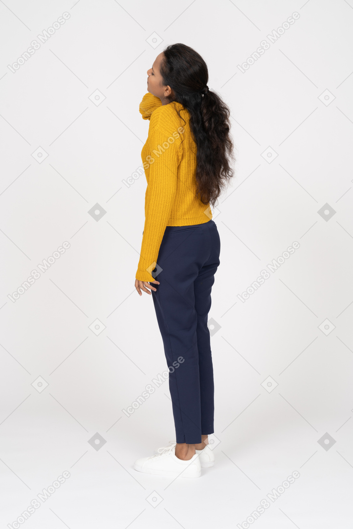 Side view of a girl in casual clothes suffering from neck pain