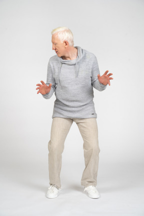 Front view of a man with bent knees looking away