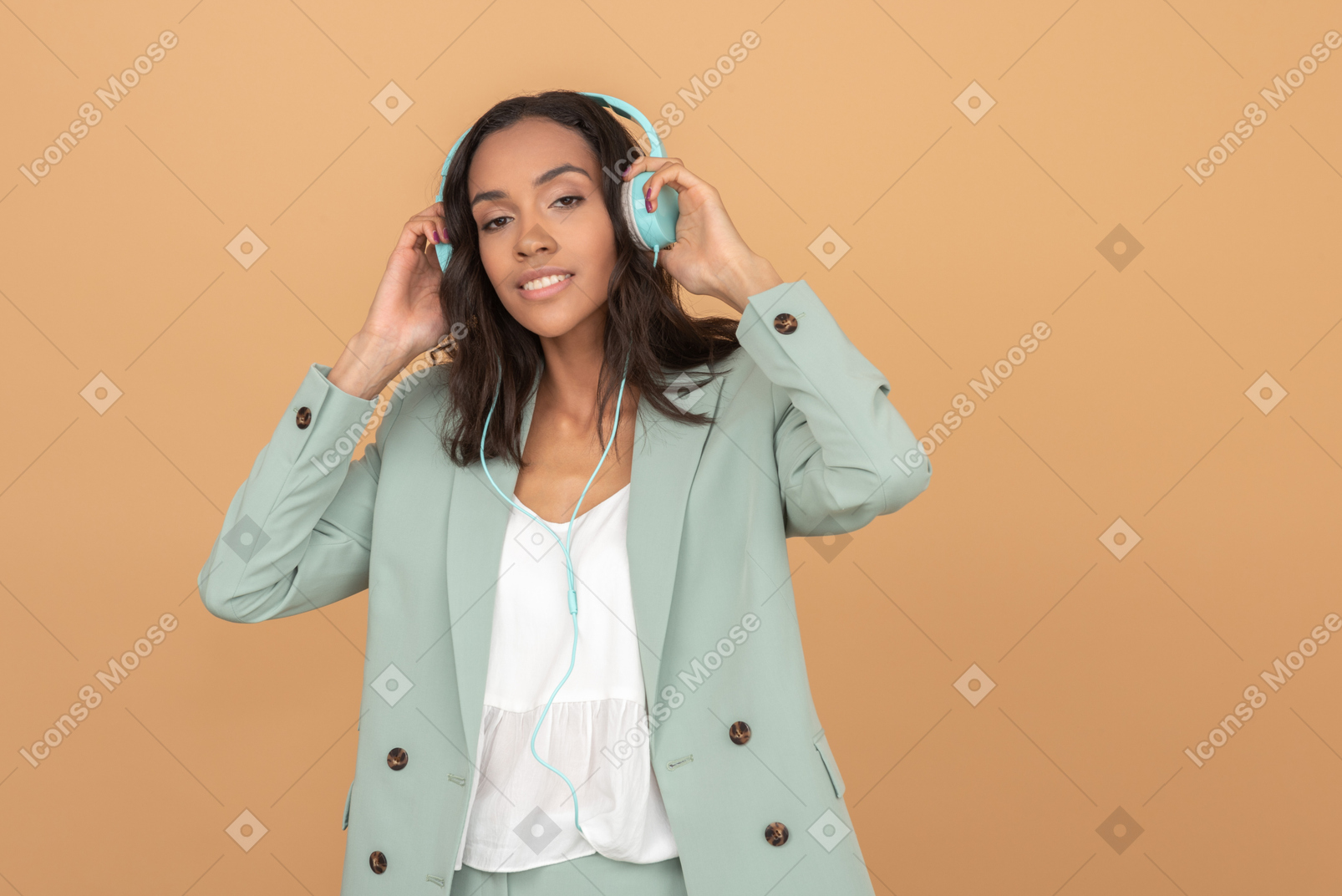 Attractive young girl listening to music in headphones