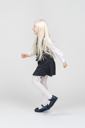 Side view of a schoolgirl marching