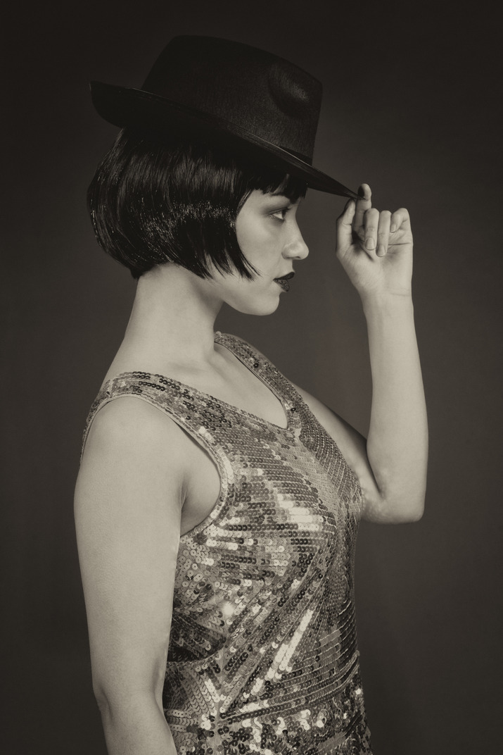 Vintage style woman wearing a hat in profile
