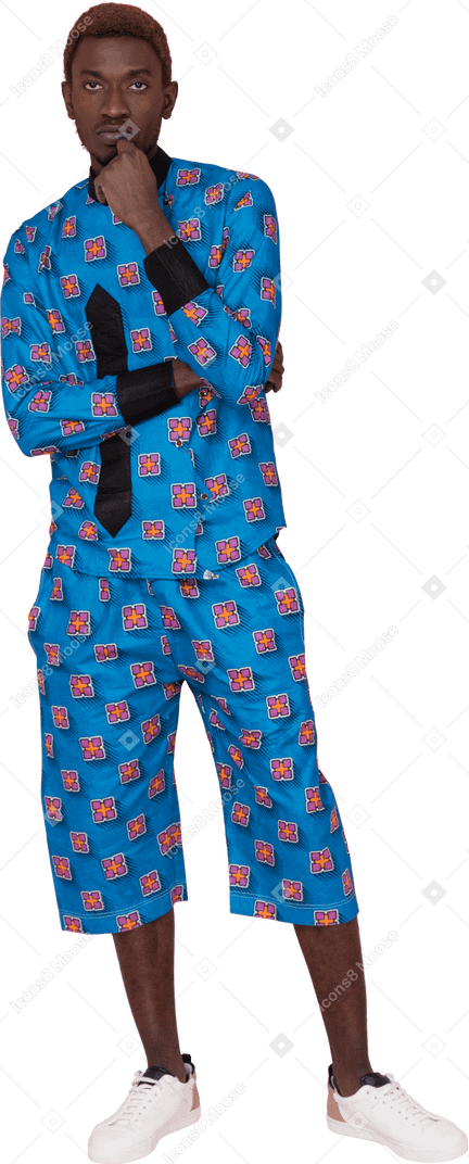 Black man in blue pajamas looking at camera