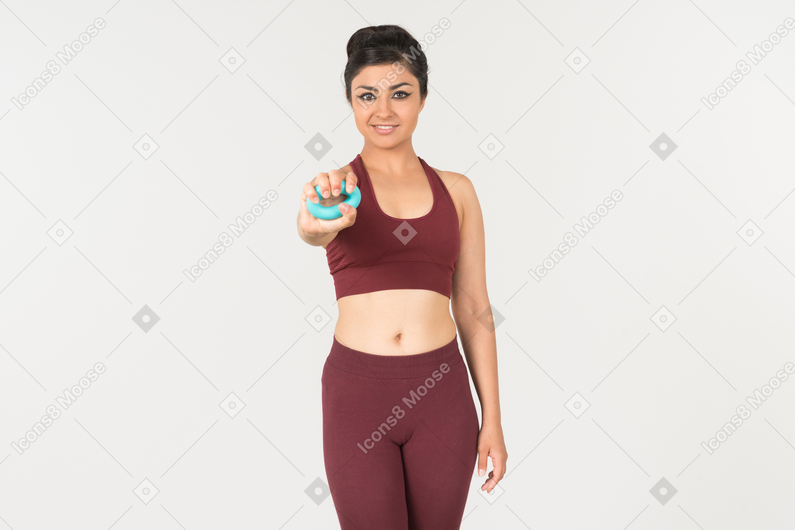 Young indian woman in sporstwear holding cloth ruler folded in her wrist