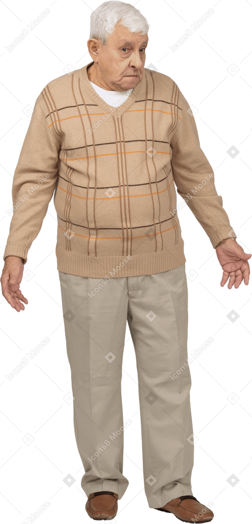Front view of a confused old man in casual clothes standing with outstretched arms