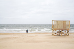 Seashore with people walking along the coastline