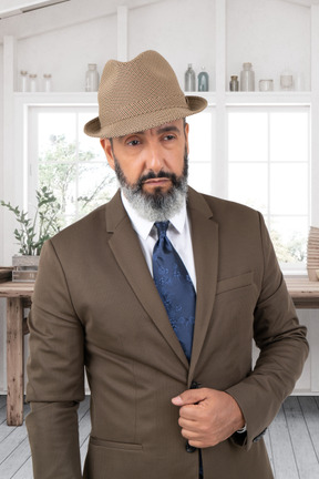 A man with a beard wearing a suit and tie