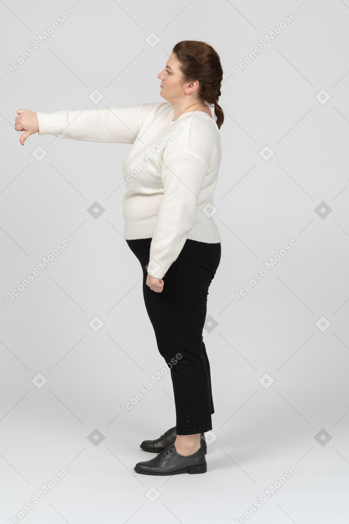 Plus size woman showing thumb down