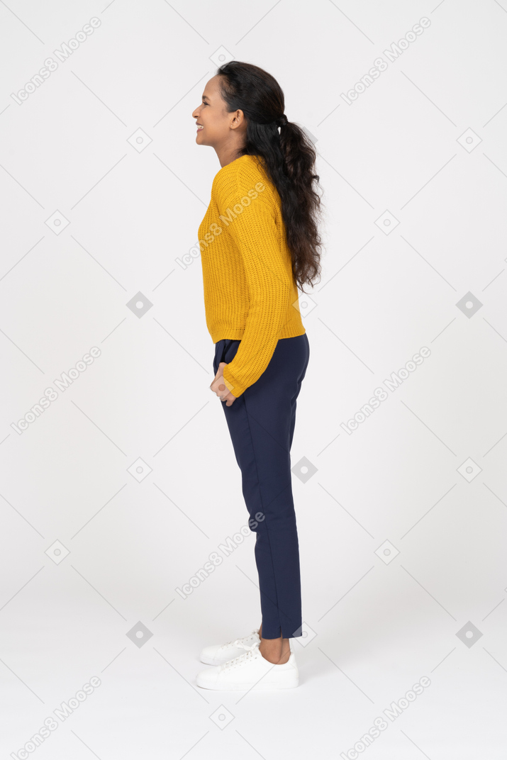 Side view of a happy girl in casual clothes